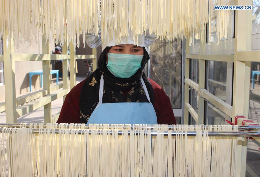 AFGHANISTAN-MAZAR-I-SHARIF-NOODLE FACTORY-WOMEN