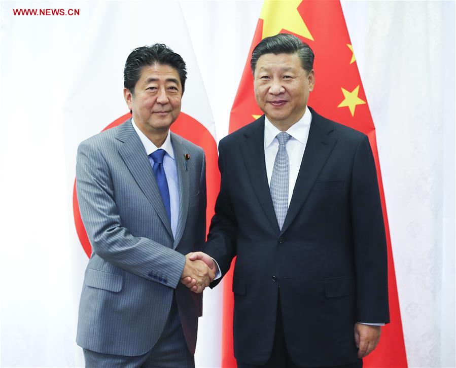 RUSSIA-VLADIVOSTOK-XI JINPING-JAPAN-PM-MEETING