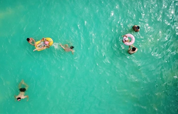 People cool off in Huai'an, east China's Jiangsu