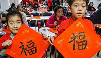 Locals write Chinese character "Fu" to mark upcoming Spring Festival