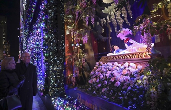 People enjoy Christmas season in New York City